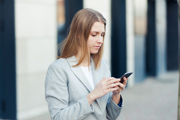 Fototapeta na wymiar Young woman wearing casual using smartphone outdoor