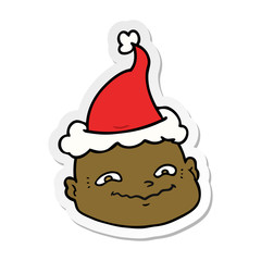 sticker cartoon of a bald man wearing santa hat