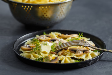 Homemade pasta with mushrooms. Delicious rustic dish, one large portion.