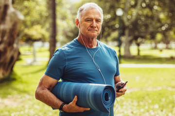 Senior fitness person walking in park