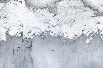 Background, metal mesh covered and smeared with concrete.