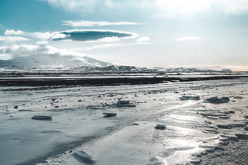 Beautiful highland iceland blue lake near Hekla among snow mountains.