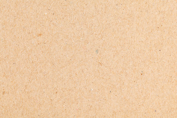 Sheet of paper brown cardboard. Texture closeup, natural rough textured paper background.