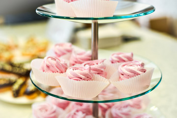 A wedding cake made of many little cupcakes