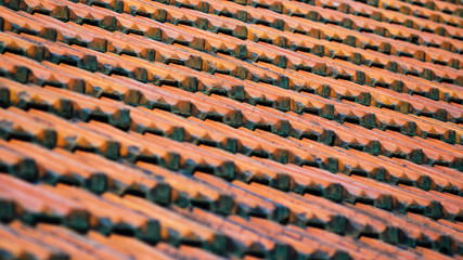 Old Red Ceramic Roof Tiles Background. Old pitched roof
