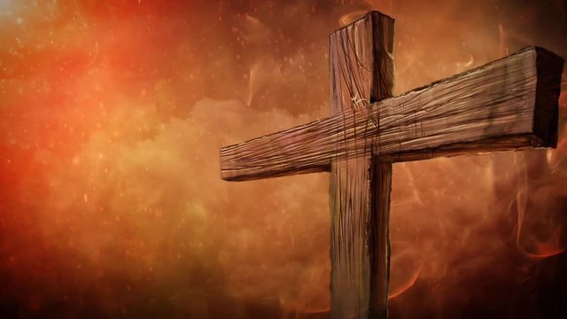Fiery Cross Close Silhouette 4K Loop features a smoky orange atmosphere and a close-up of a cross in the foreground