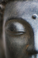 Buddha face close up shot. Buddhist religion concept idea