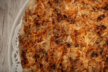 Homemade apple pie dessert on a wooden table closeup.