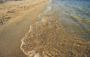 sand beach waterfront coast line  perspective background with soft blue colors water and waves of Mediterranean sea, tourism and summer vacation wallpaper pattern photography with empty copy space