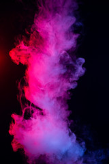 Colourful cloud of vapor. dark black background