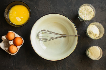 raw dough mix ingredients (eggs, flour and others). food background. copy space