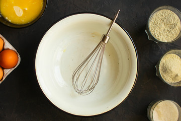 raw dough mix ingredients (eggs, flour and others). food background. copy space