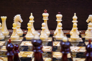 Black and white chess pieces on a chess board