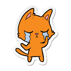 sticker of a crying cartoon cat