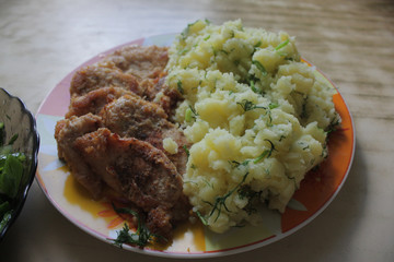 Dish consisting of fried meat and boiled potatoes