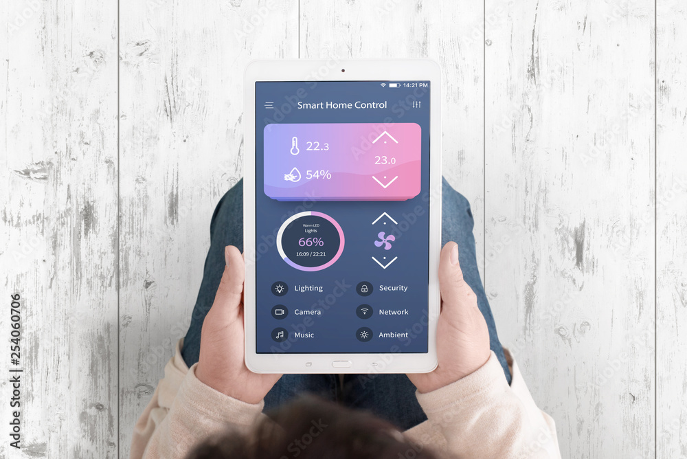 Poster smart home control concept app on teblet in woman hands. flat design interface. top view. white wood