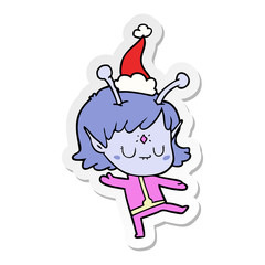 sticker cartoon of a alien girl wearing santa hat