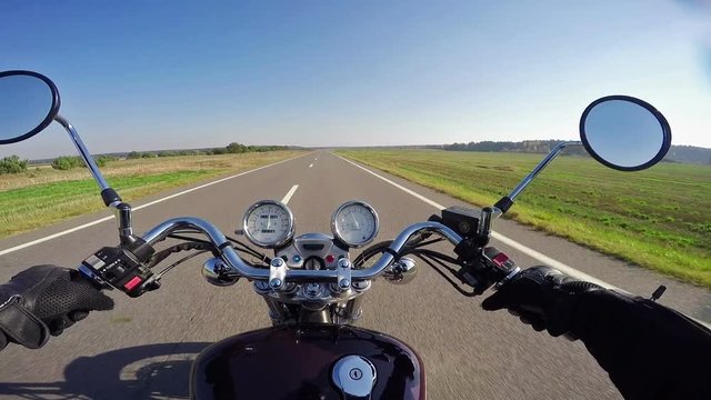 Amazing motorcycle riding on the beautiful empty road. Classic cruiser/chopper forever! 