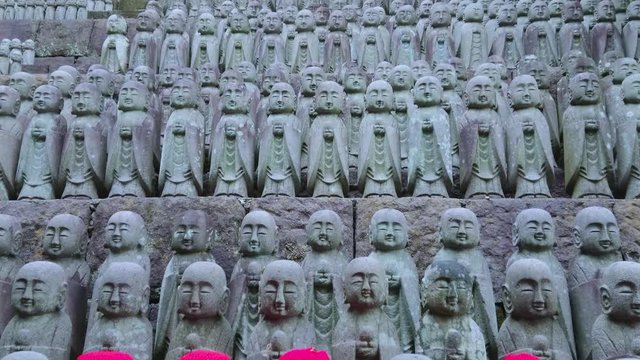 Small praying monk statues at Hase Dera Temple in Kamakura