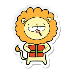 sticker of a cartoon bored lion with present