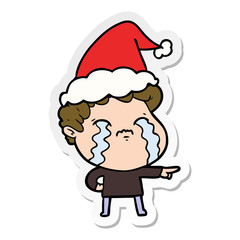 sticker cartoon of a man crying wearing santa hat