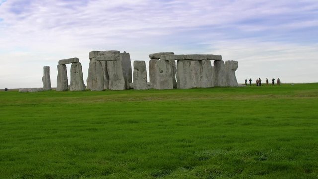 Beautiful Stonehenge with green grass and tourists 4k