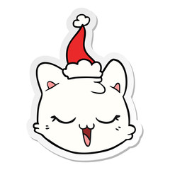 sticker cartoon of a cat face wearing santa hat