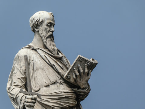 Statue of the apostle St. Paul holding a broken sword and a book with the pedestal inscription Borgo, on Ponte Sant'Angelo, Rome, Italy. The sculpture was by the Italian early Renaissance Paolo Romano