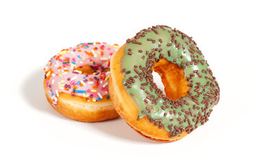 Colorful glazed donuts on white background.