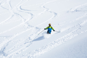 Fototapeta na wymiar Telemark skiing on powder slope with few ski tracks in Hokkaido