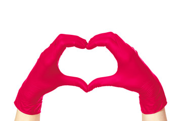 Obraz premium Female hands in pink gloves hold fingers in the shape of a heart isolated on white background