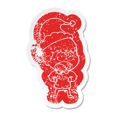cartoon distressed sticker of a shocked man wearing santa hat