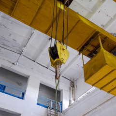 Hoist with winch and hook. A tool for moving goods in a producti