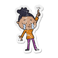 distressed sticker of a cartoon crying woman raising hand