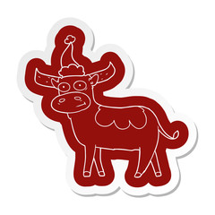 cartoon  sticker of a bull wearing santa hat