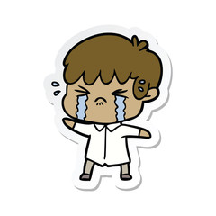 sticker of a cartoon boy crying