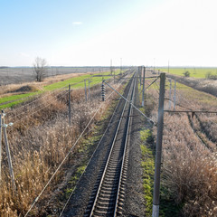 Fototapeta na wymiar Plot railway. Top view on the rails. High-voltage power lines for electric trains