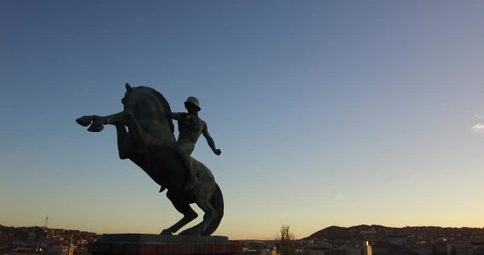 Equestrian Statue on the  Arpad Toth Promenade with the sunset over the Buda Hills.