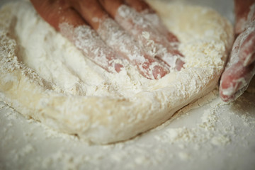 Stretching pizza dough 