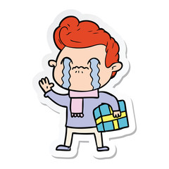 sticker of a cartoon man crying
