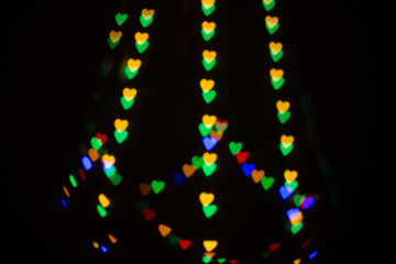 Colorful abstract heart shape blured bokeh at night