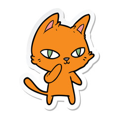 Obraz na płótnie Canvas sticker of a cartoon cat staring