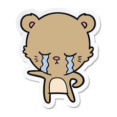 sticker of a crying cartoon bear