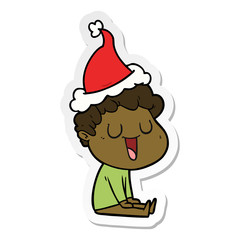 laughing sticker cartoon of a man wearing santa hat