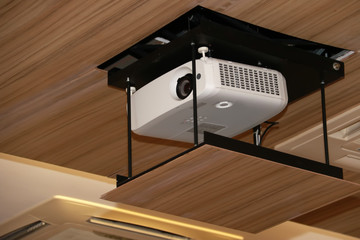 projector hanging on meeting room ceiling