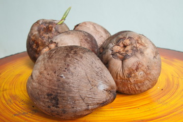 Coconut old on the table.