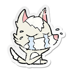distressed sticker of a cartoon crying wolf