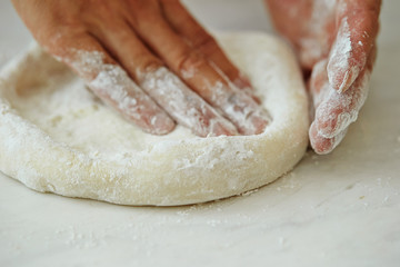 Stretching pizza dough 