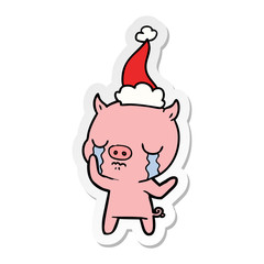 sticker cartoon of a pig crying wearing santa hat