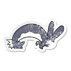 distressed sticker of a funny cartoon rabbit